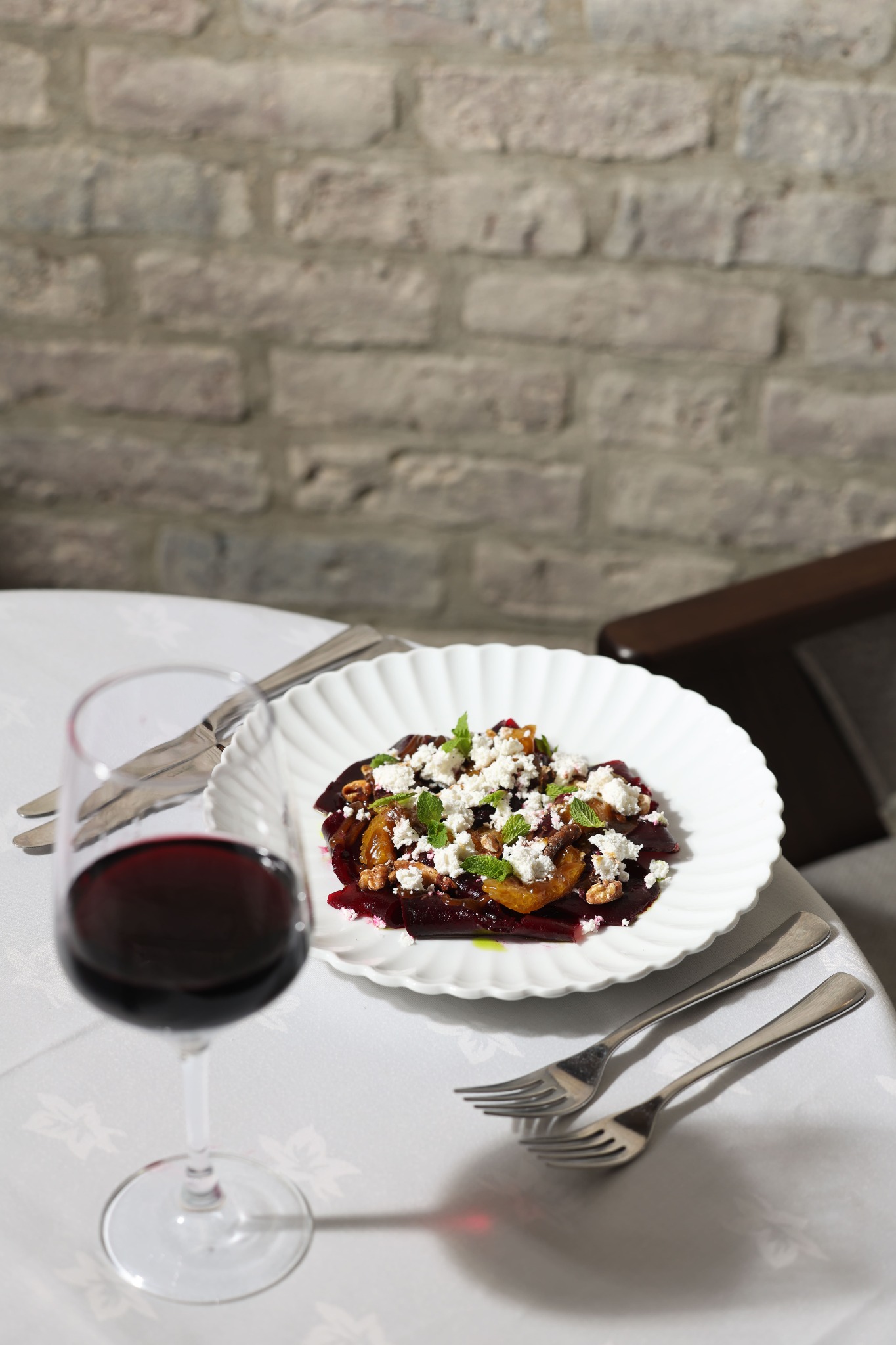 A beetroot and feta dish served with red wine at Yammas
