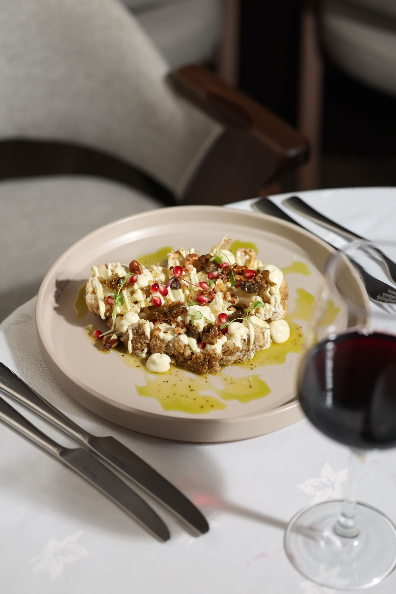 Roasted cauliflower with pomegranate and creamy sauce