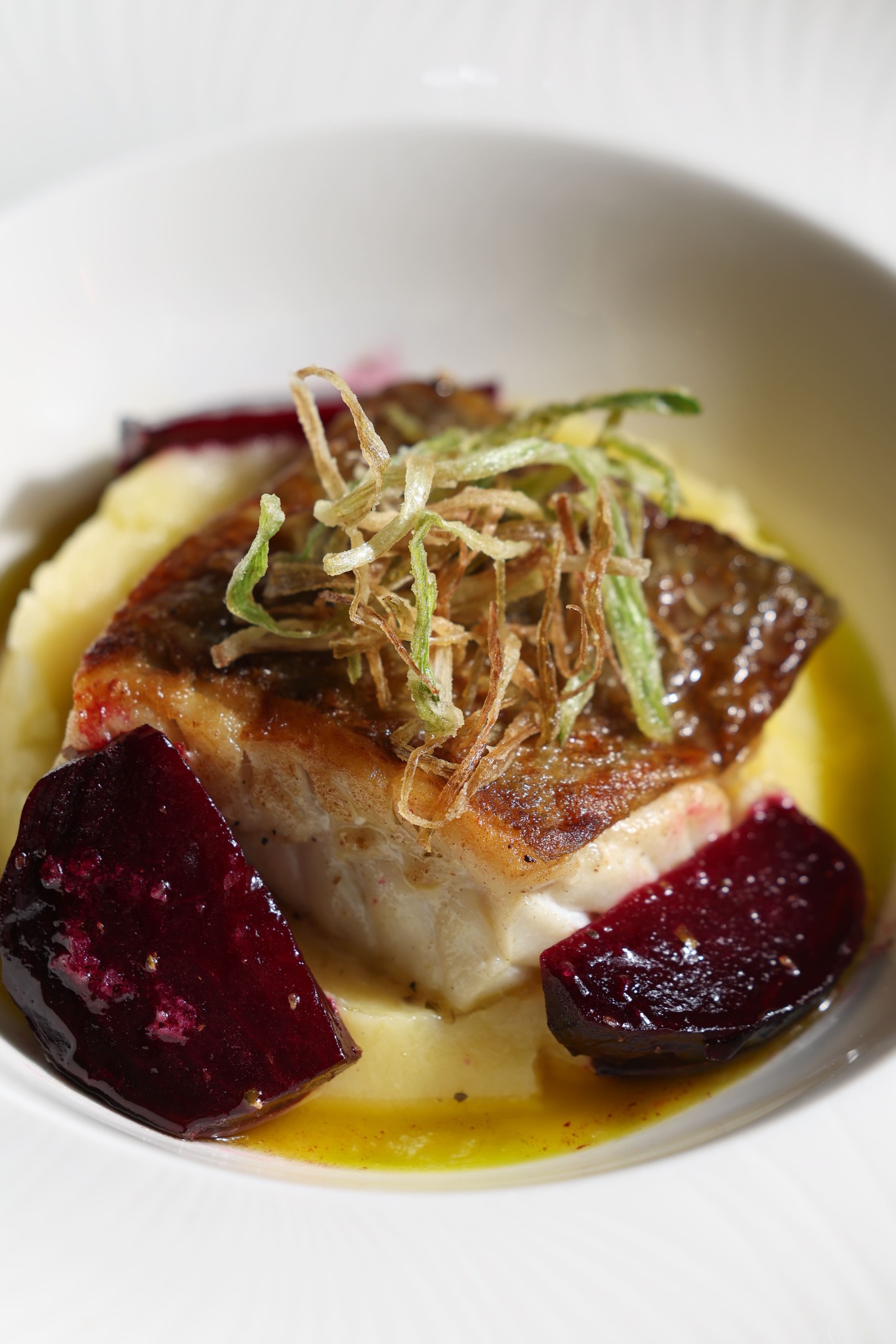 Seared fish with beetroot and crisp garnish at Yammas